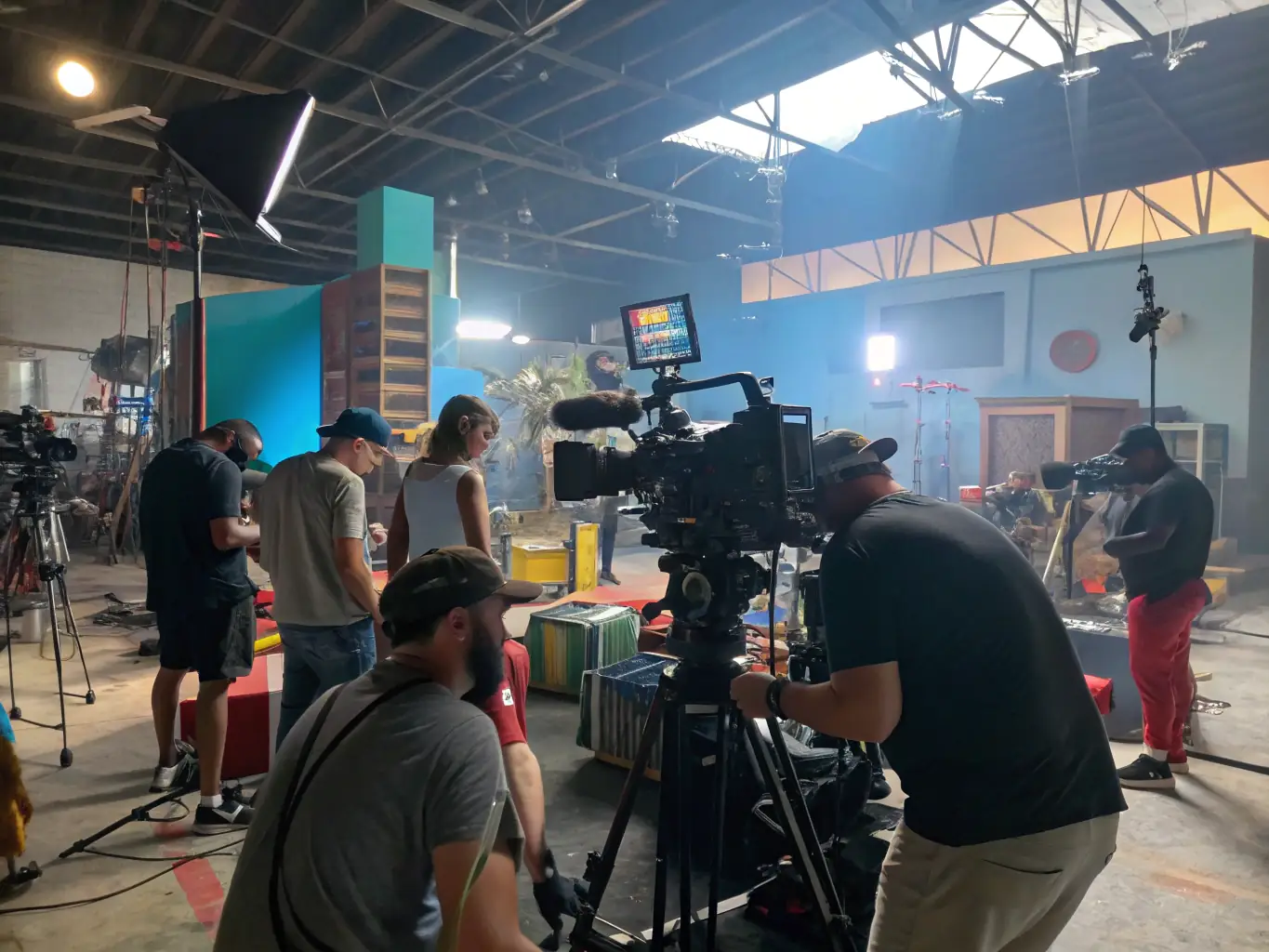 A dynamic image showcasing a diverse team of artists and production staff collaborating on a film set, emphasizing the collaborative and creative environment at Eighty Production.